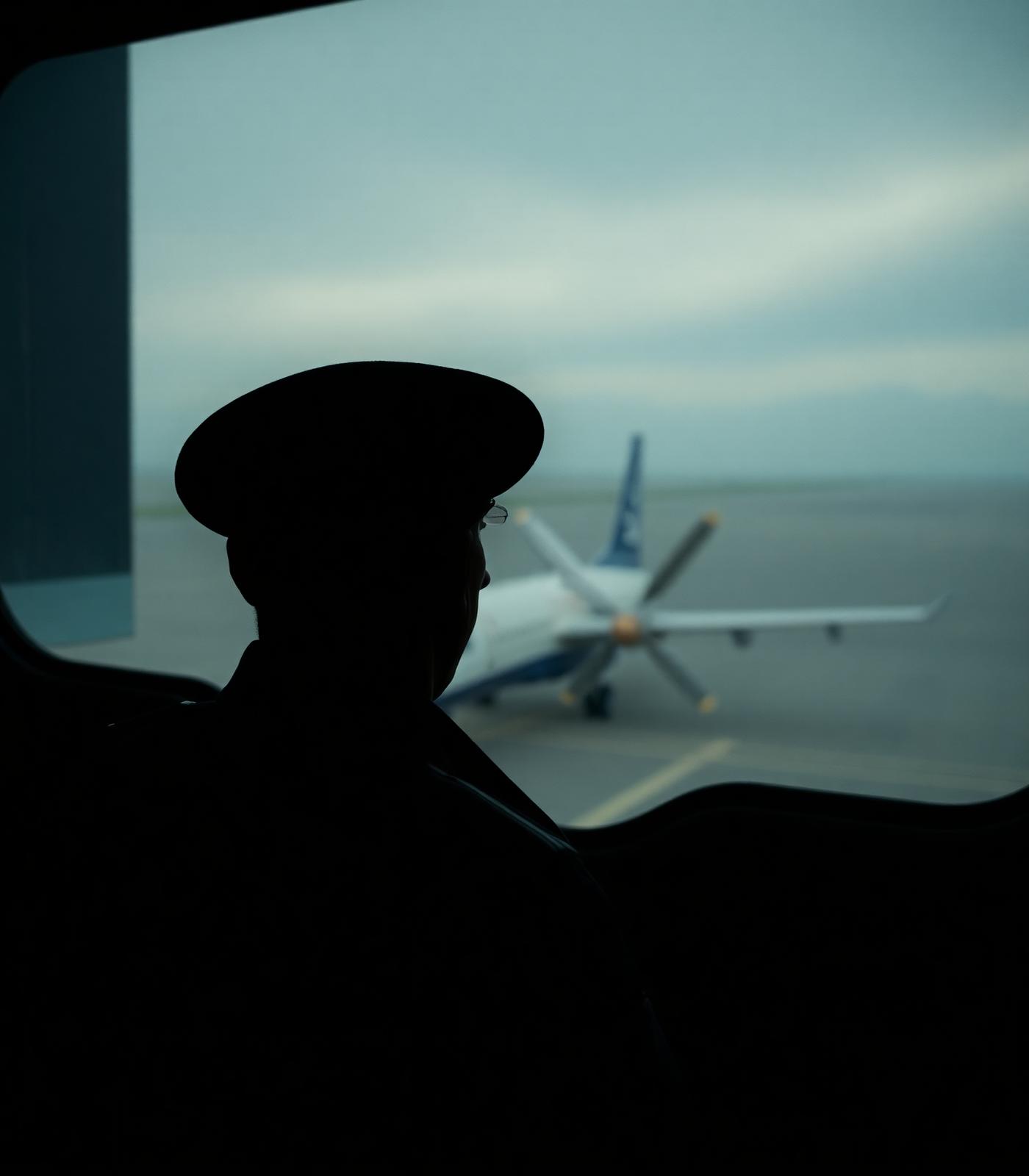 Pilot at hangar window